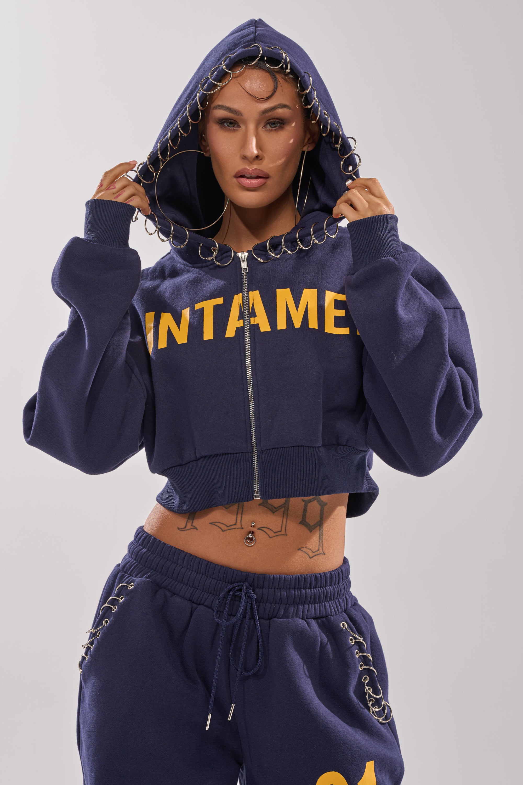 UNTAMED METAL RING SWEATSHIRT